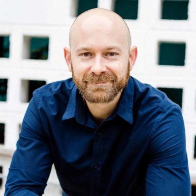 Headshot of Thomas Everts, PA sitting with his elbows on his knees, smiling into the camera.